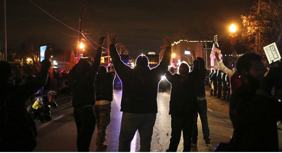 https://www.pbs.org/newshour/classroom/app/uploads/2014/11/protesters-approach-police-line630.jpg