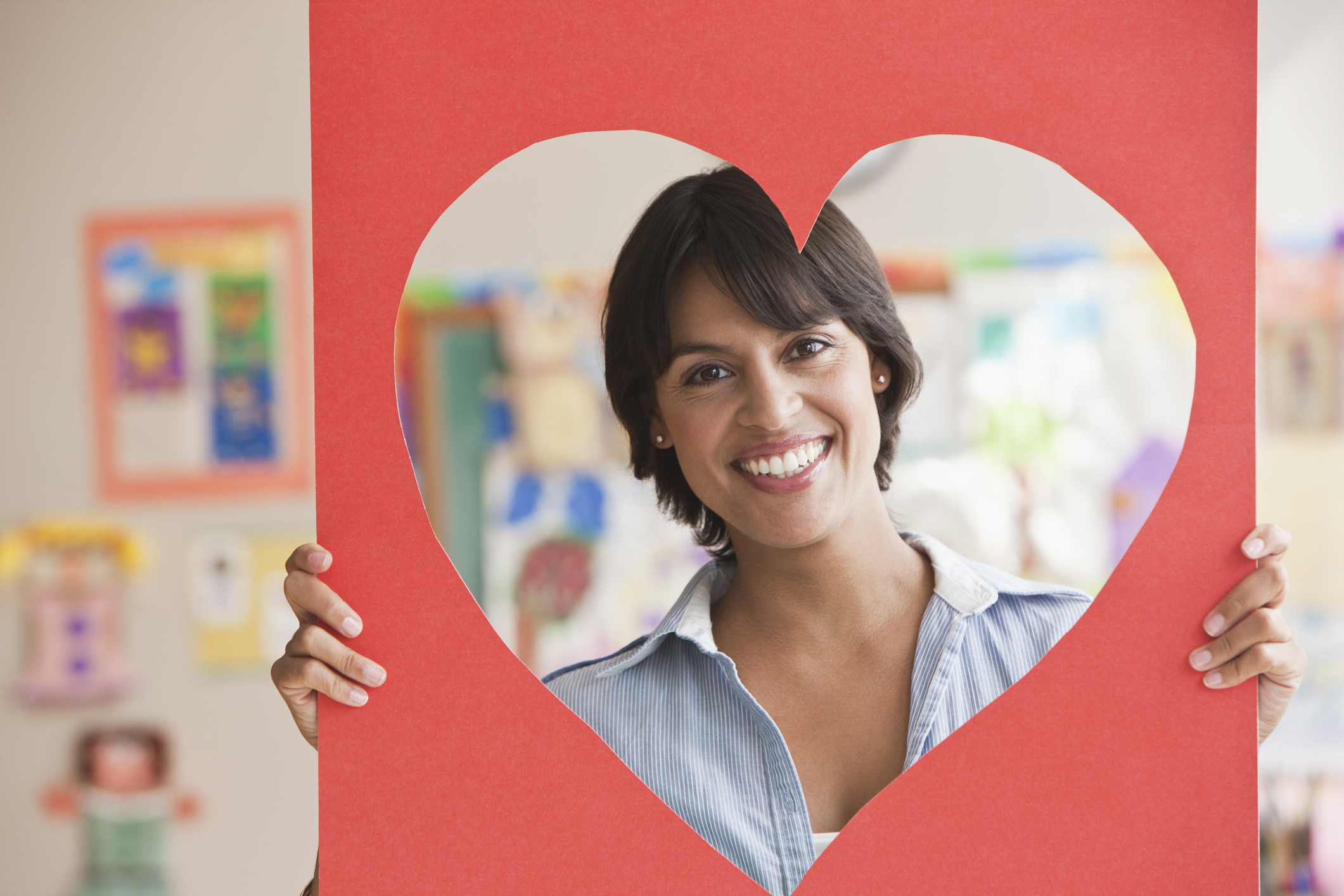 stock photo of person with heart-shaped frame