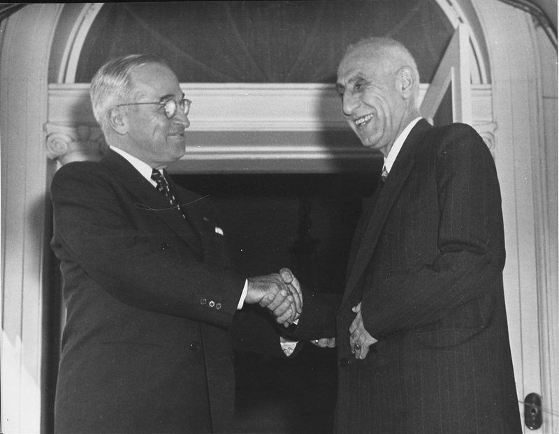 President Harry S. Truman greets Prime Minister Mohammad Mosaddegh of Iran as the latter arrives at Blair House, temporary Presidential residence in Washington D.C., Oct. 23, 1951.