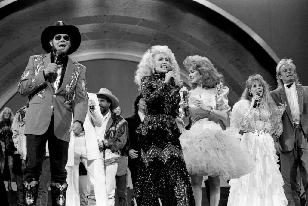 Host Dolly Parton has the other stars join her during her hand-clapping country anthem to starts the 22nd annual CMA Awards show at the Grand Ole Opry House in Nashville, Tennessee, U.S. October 10, 1988. Callie Shell/USA Today Network via REUTERS.