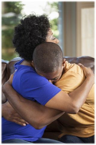 child and adult hugging