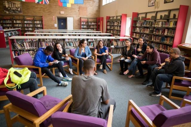 students seated in a circle