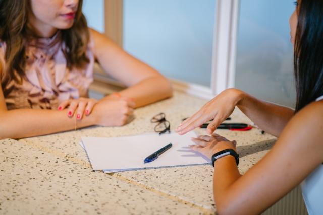 Job Interview candidate discusses resume with employer